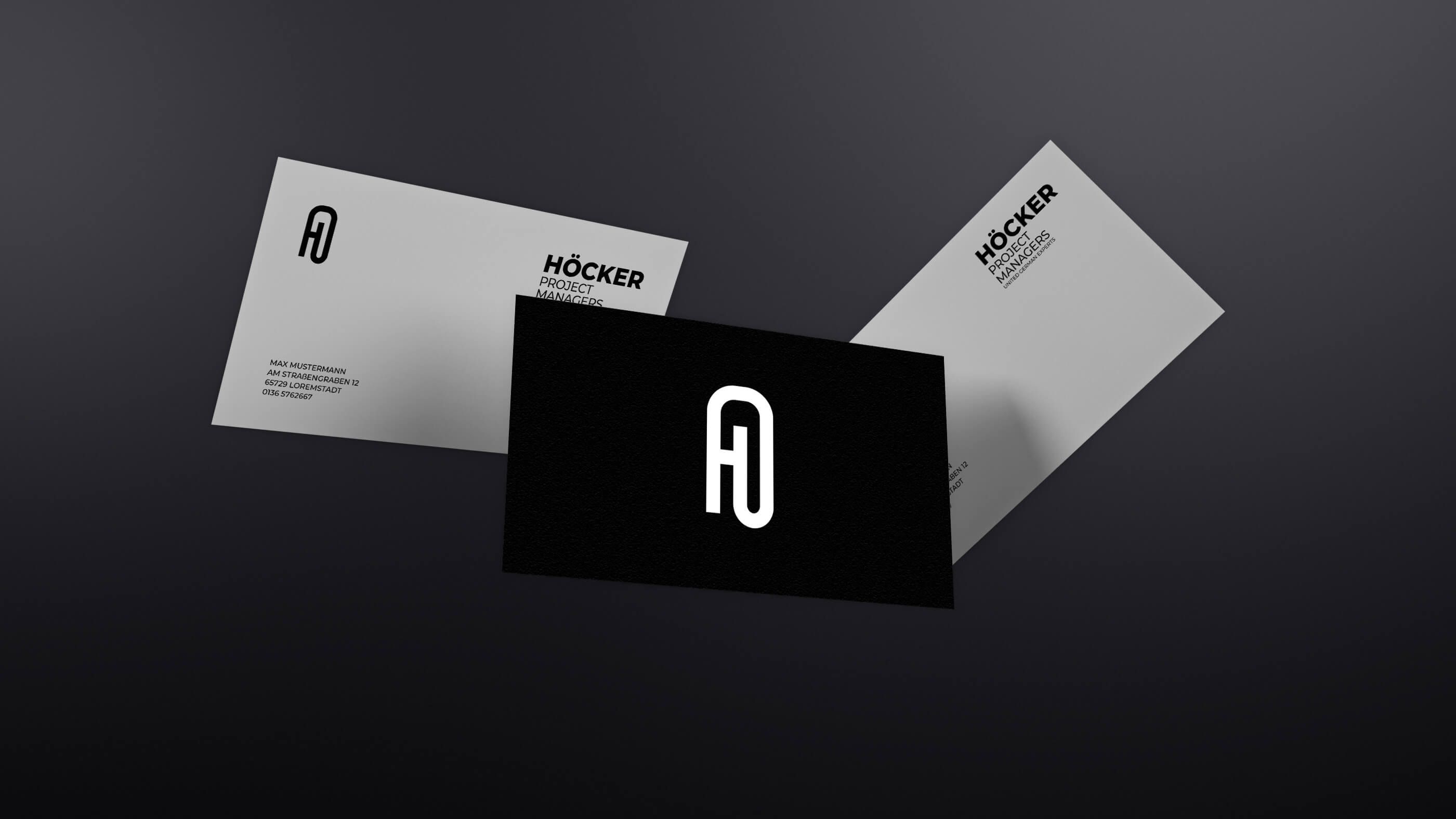 3 business cards floating around showing the front page with the logo and the back with information.